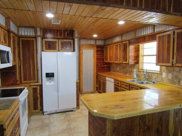 1112 Country Living Road Baker, FL 32531 - Photo 4 of 16 a kitchen with stainless steel appliances granite countertop a sink and a refrigerator