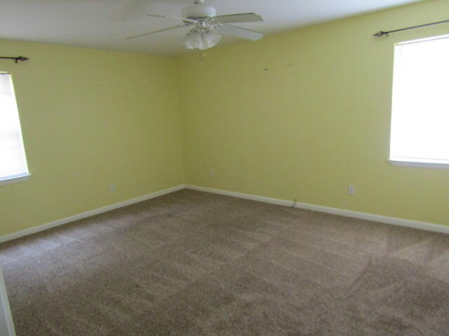 1112 Country Living Road Baker, FL 32531 - Photo 7 of 16 an empty room with a window