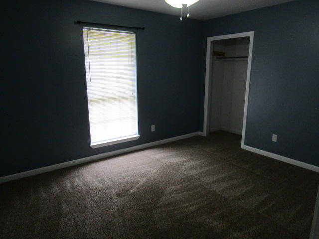 1112 Country Living Road Baker, FL 32531 - Photo 10 of 16 an empty room with windows