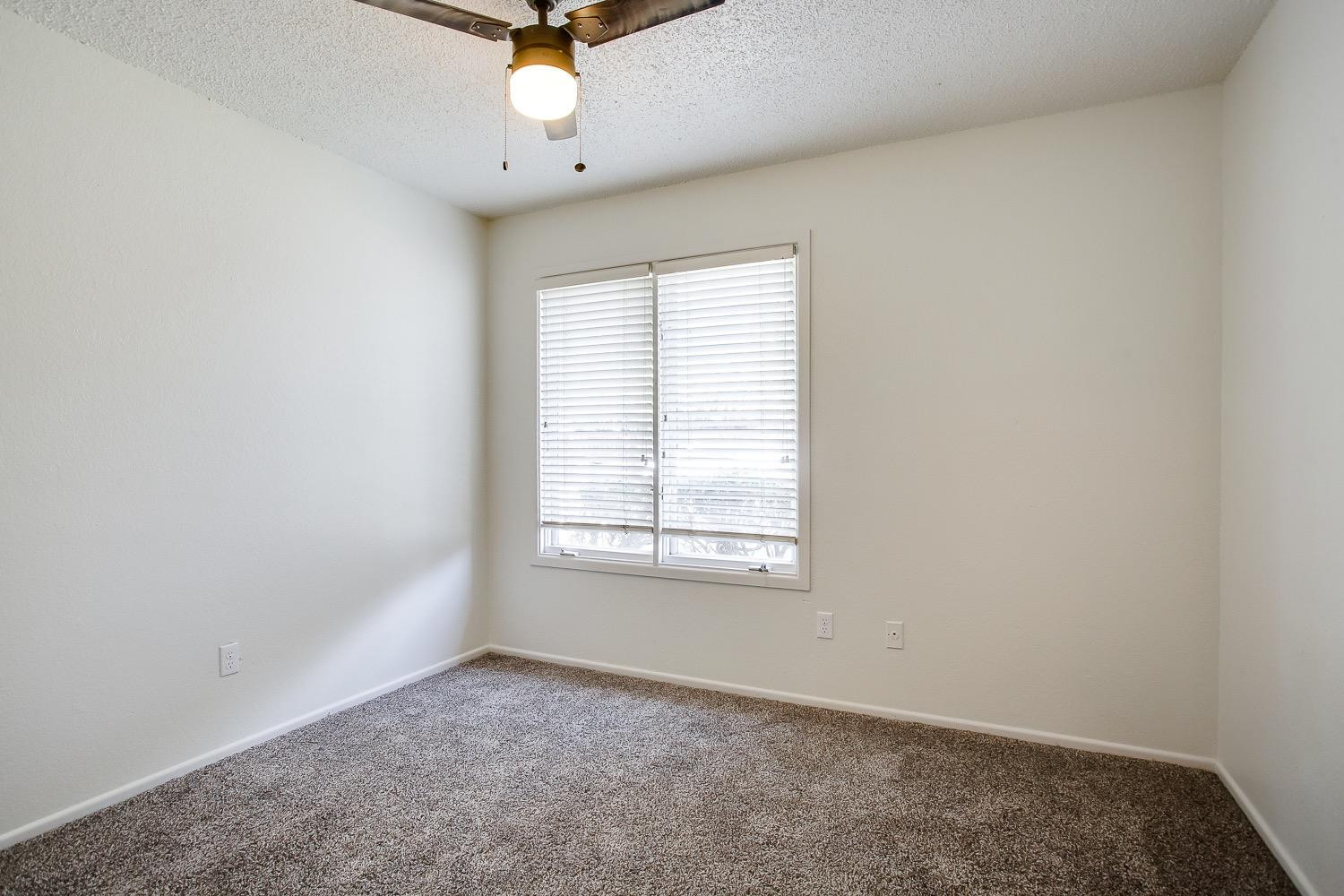 4749 2nd Street Lubbock, TX 79416 - Photo 12 of 13 an empty room with a window