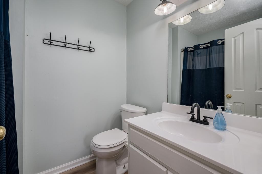 636 Crescent Road Murfreesboro, TN 37128 - Photo 11 of 22 a bathroom with a sink a toilet a mirror and shower