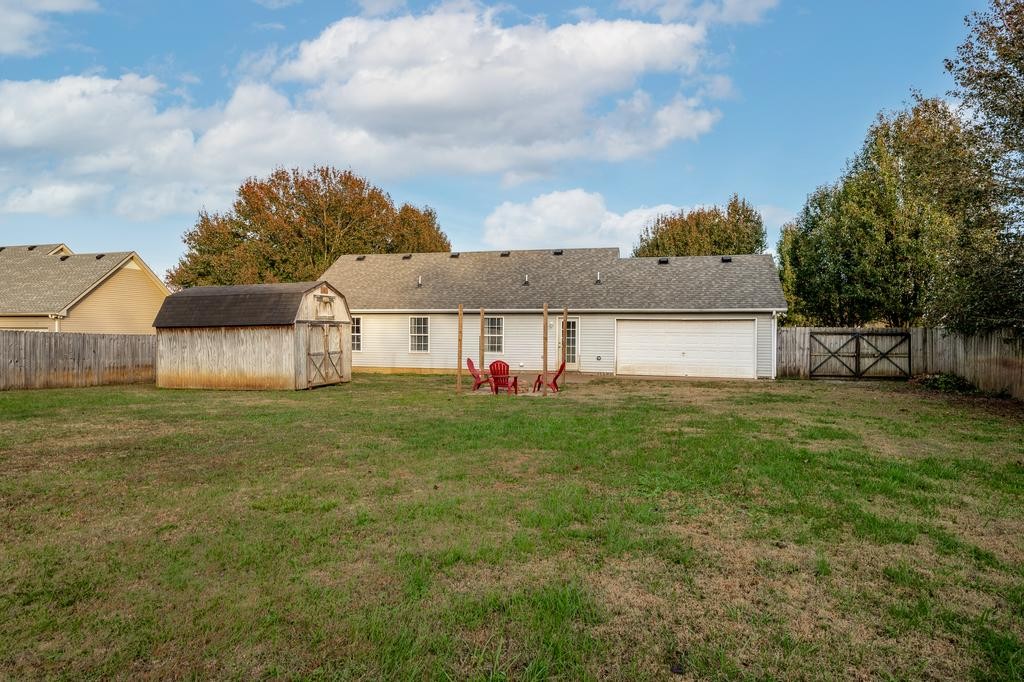 636 Crescent Road Murfreesboro, TN 37128 - Photo 16 of 22 a view of a house with backyard and a garden