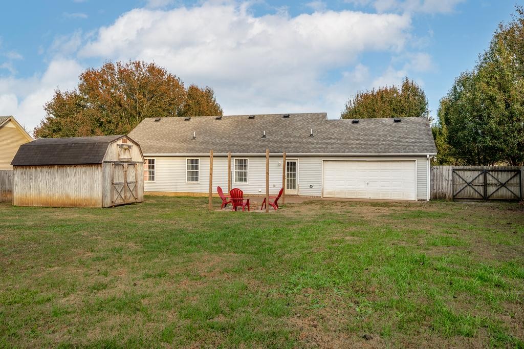 636 Crescent Road Murfreesboro, TN 37128 - Photo 17 of 22 a front view of a house with a yard and garage