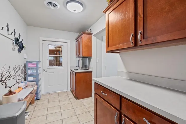 a room with furniture pool table and chair