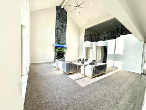 a large bathroom with a double vanity sink a large mirror and a bathtub