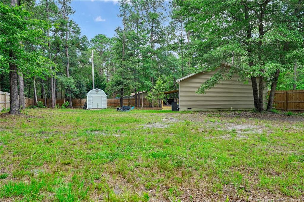 8155 Arabia Road Lumber Bridge, NC 28357 - Photo 30 of 30 a house view with a outdoor space