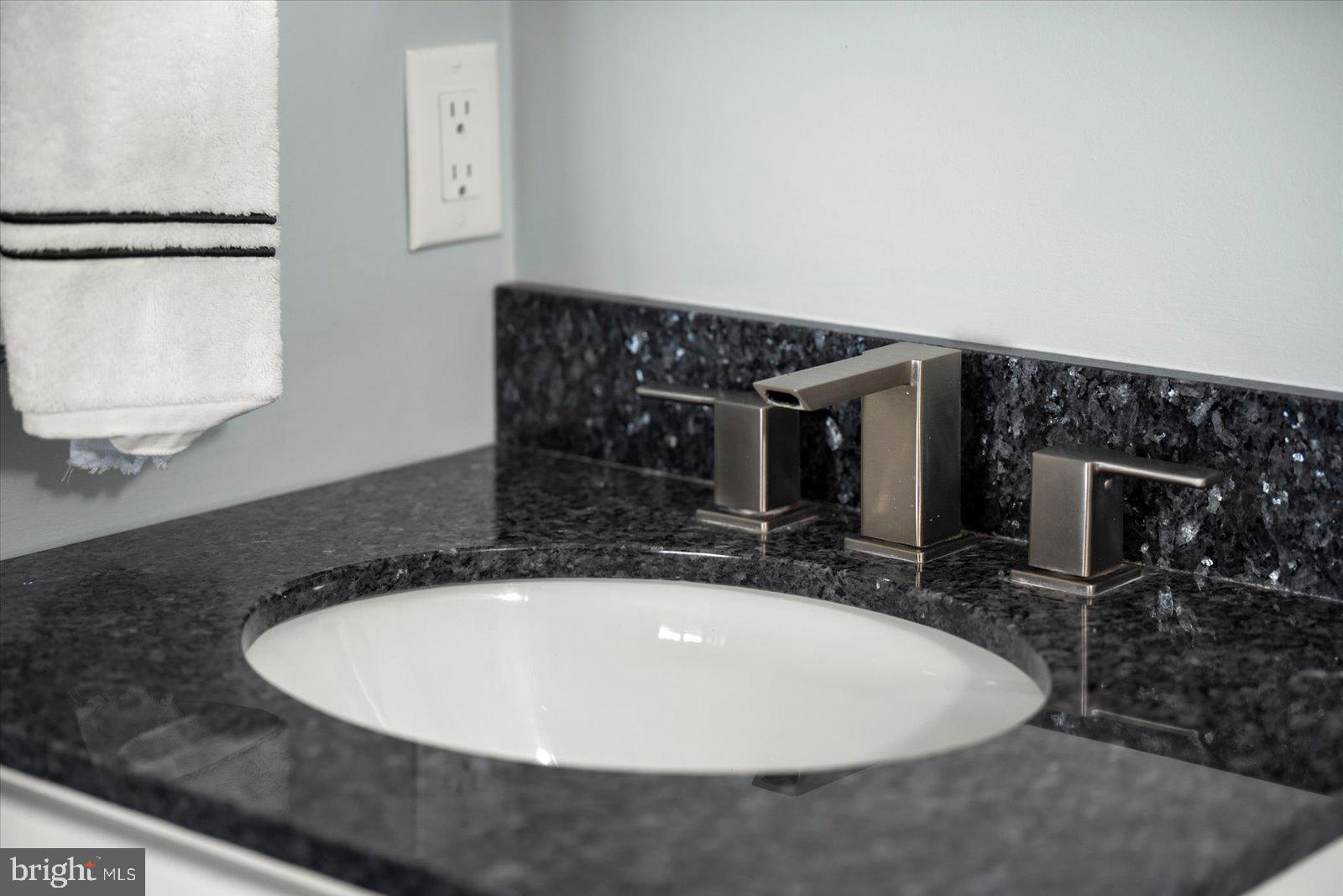 12957 Harbor Road Ocean City, MD 21842 - Photo 112 of 148 a bathroom with a sink and a mirror