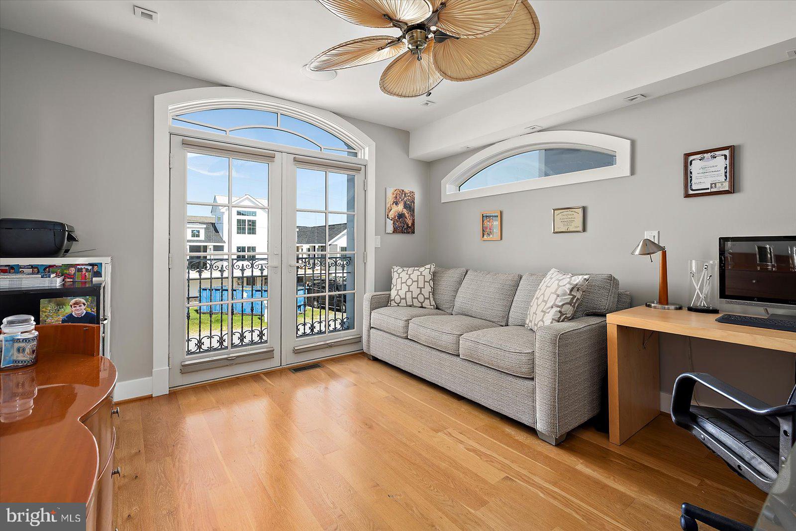 12957 Harbor Road Ocean City, MD 21842 - Photo 123 of 148 a living room with furniture a flat screen tv and a window