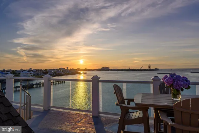 a bathroom with a granite countertop sink and a window