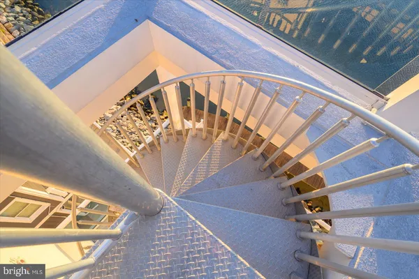 a view of a dining room with furniture wooden floor and a chandelier