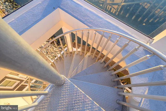 a view of a dining room with furniture wooden floor and a chandelier