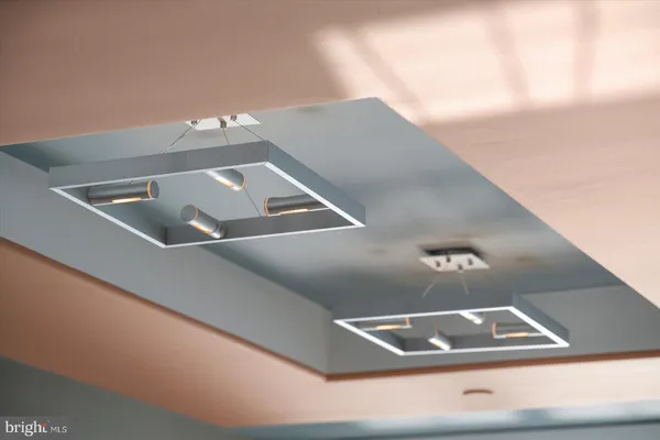 a dining hall with couches and a flat screen tv