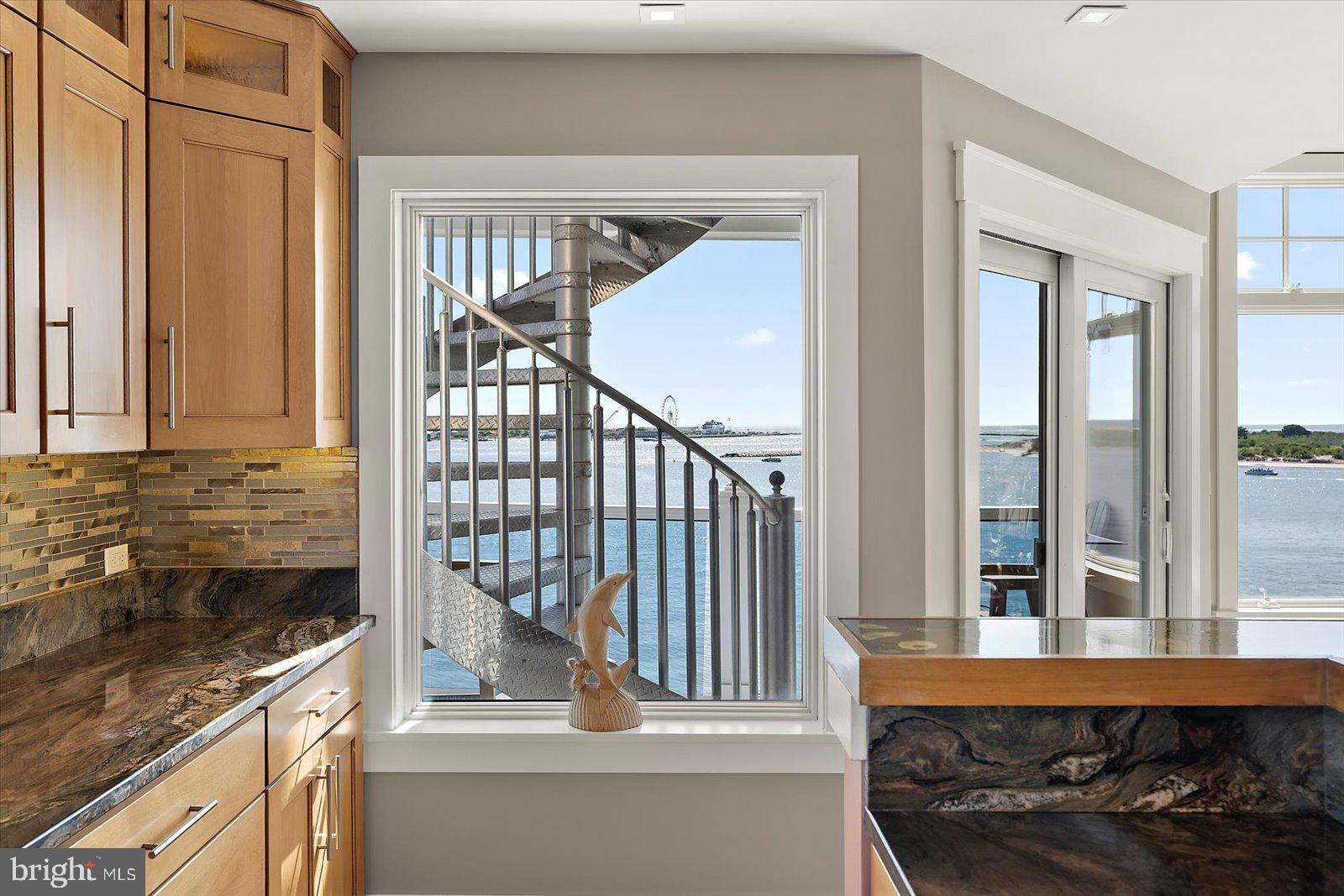 12957 Harbor Road Ocean City, MD 21842 - Photo 48 of 148 a bathroom with a granite countertop sink and a window