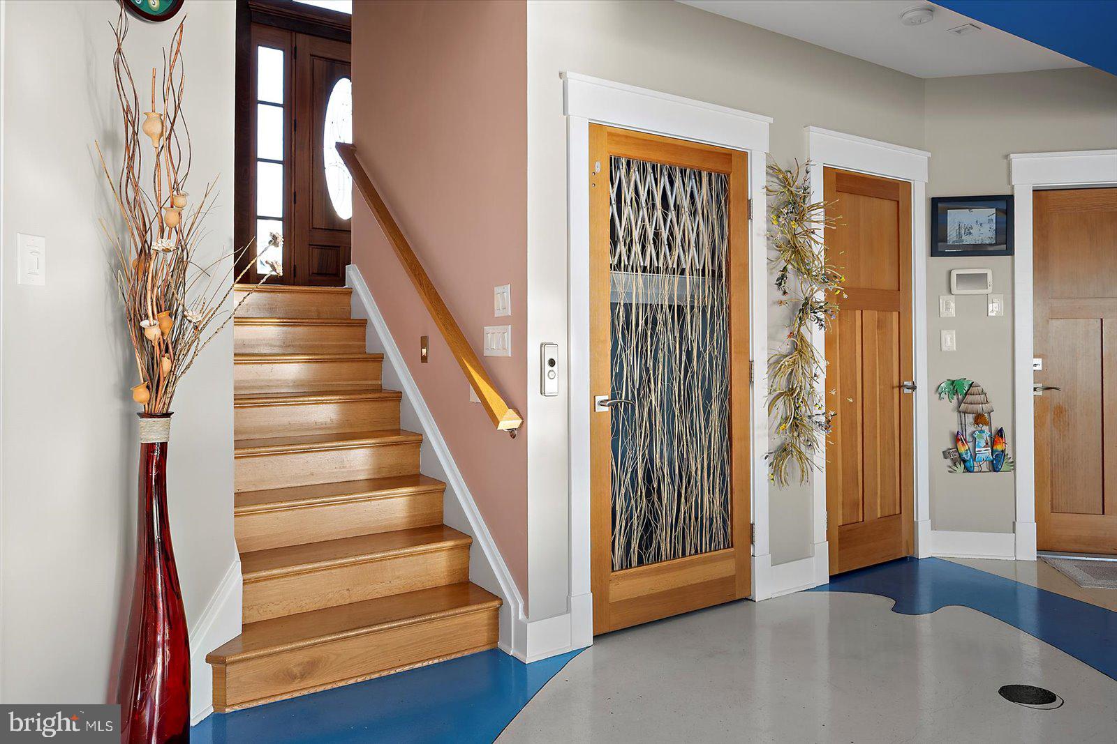 12957 Harbor Road Ocean City, MD 21842 - Photo 61 of 148 a view of a hallway with wooden floor and entryway