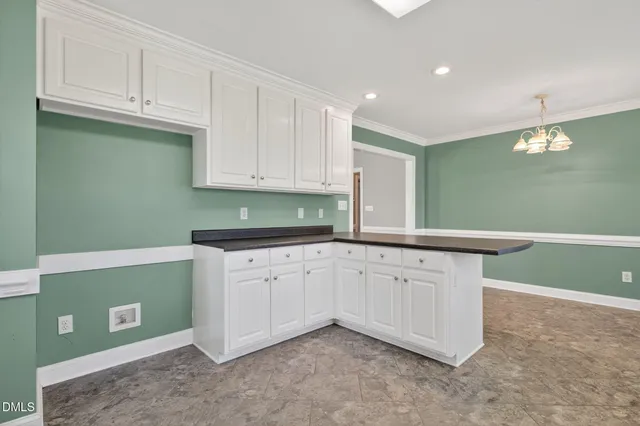 a kitchen with granite countertop cabinets and sink