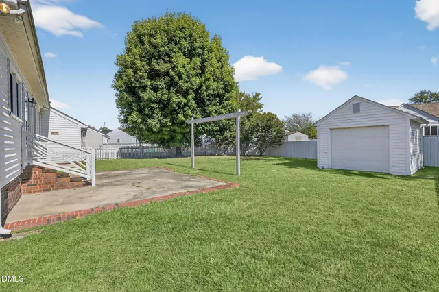 a view of backyard with green space