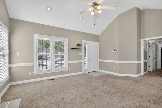 a view of an empty room with a window
