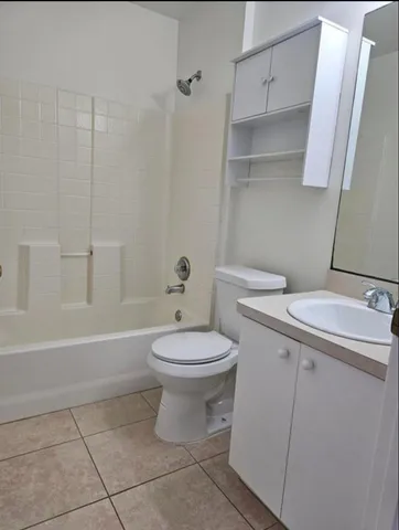 a bathroom with a toilet a sink and bathtub