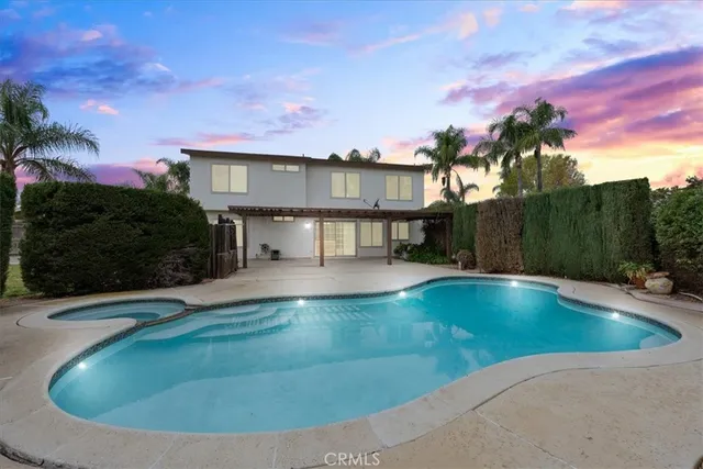 a view of a swimming pool with a yard