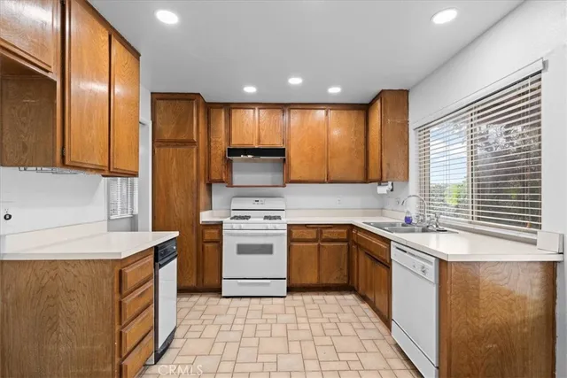 a kitchen with a sink and large window