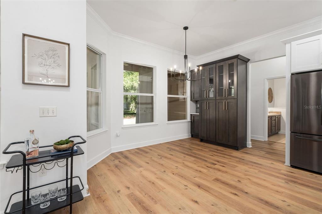 6326 Southwest 90th Street Gainesville, FL 32608 - Photo 11 of 44 a bedroom with a bed and a chandelier