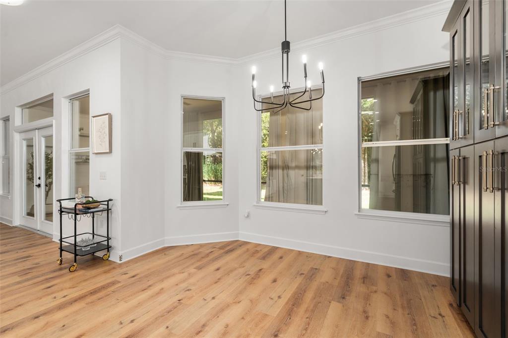 6326 Southwest 90th Street Gainesville, FL 32608 - Photo 12 of 44 a view of empty room with wooden floor and fan