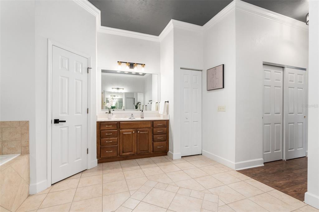 6326 Southwest 90th Street Gainesville, FL 32608 - Photo 21 of 44 a bathroom with a sink vanity and mirror