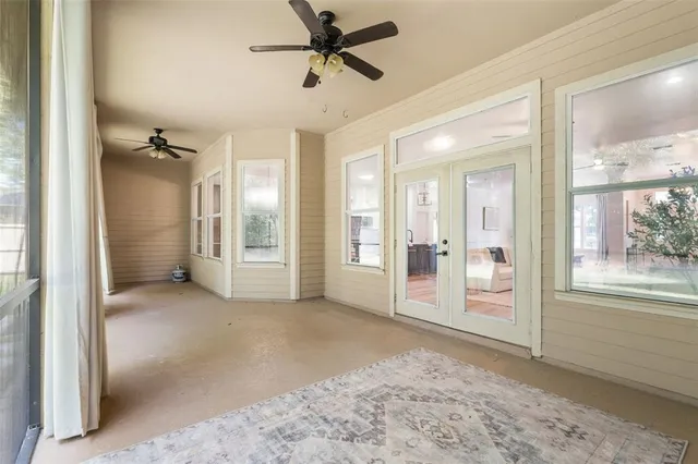 a view of a big room with entryway and wooden floor