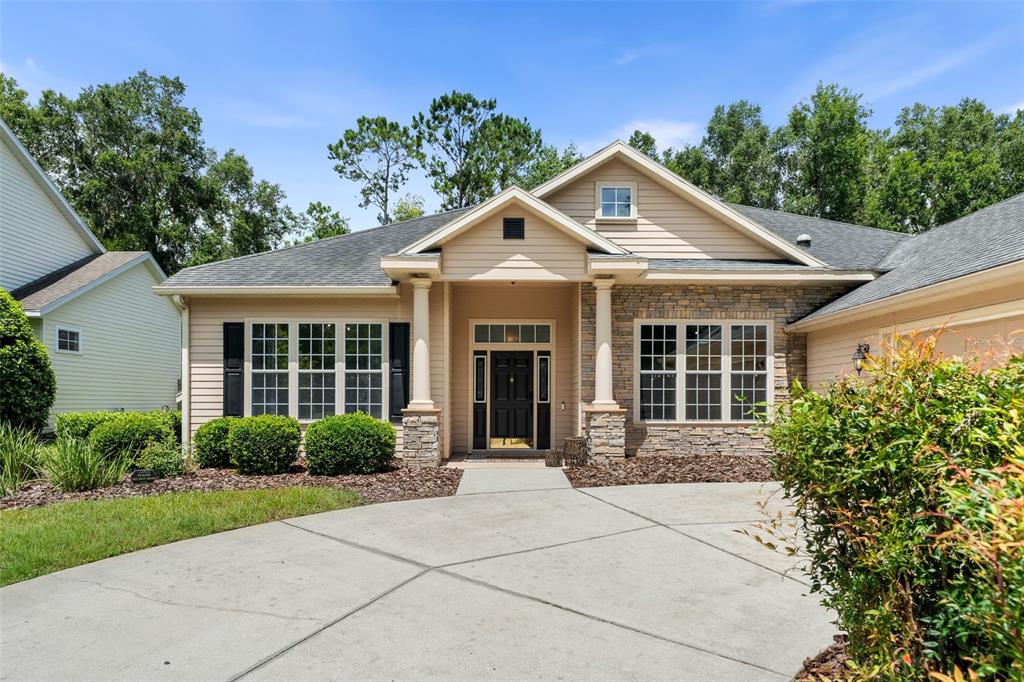 6326 Southwest 90th Street Gainesville, FL 32608 - Photo 39 of 44 a front view of a house with yard and green space