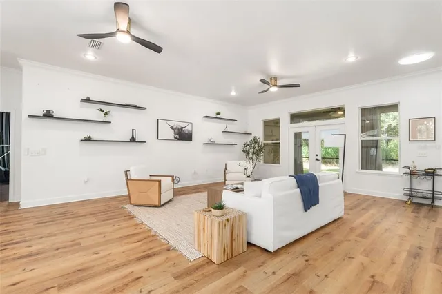 a large white kitchen with a large window