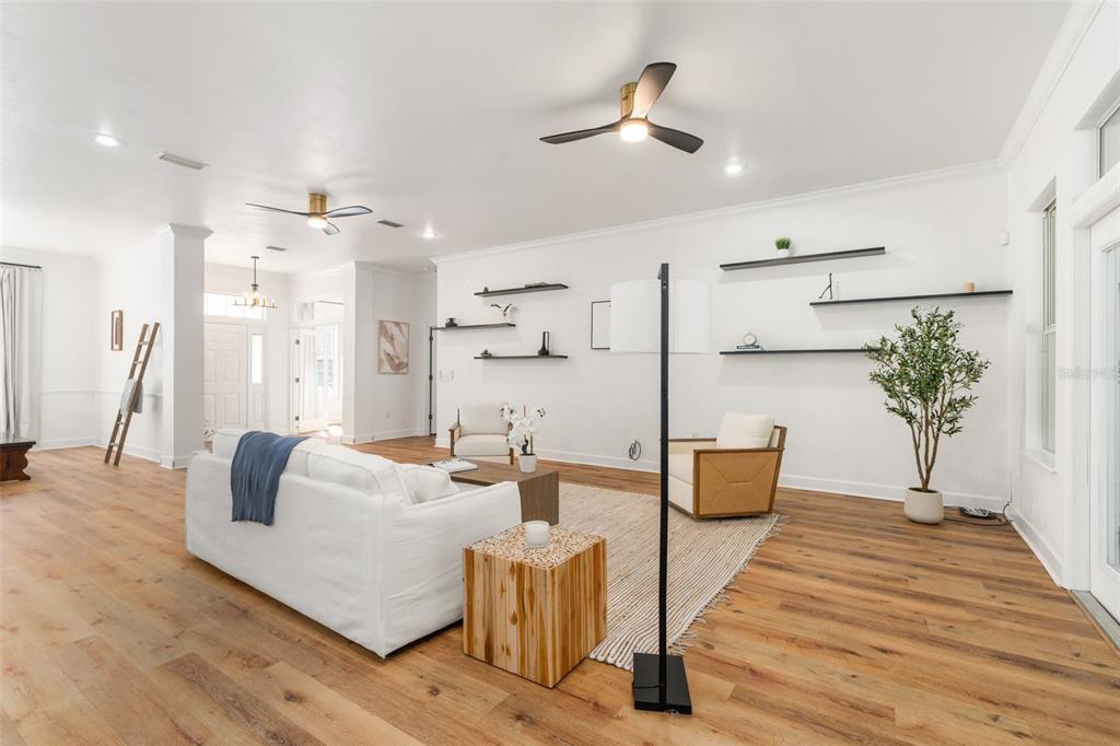 6326 Southwest 90th Street Gainesville, FL 32608 - Photo 7 of 44 a living room with furniture and a chandelier