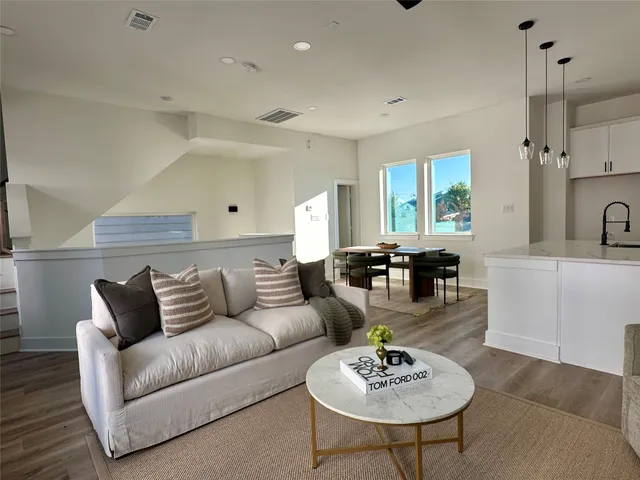 a living room with furniture and a table
