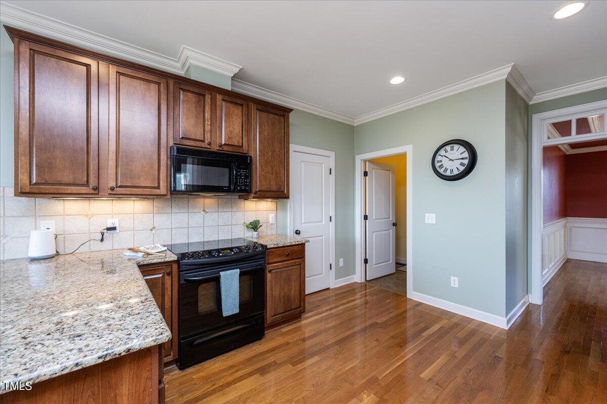 2117 Conroy Way Willow Spring, NC 27592 - Photo 12 of 38 Large kitchen with lots of counter space, a peninsula, and plenty of storage