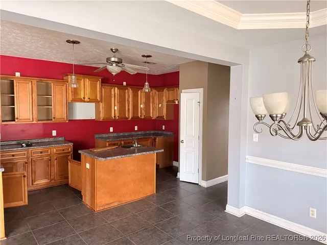 a kitchen with stainless steel appliances granite countertop a stove oven and a refrigerator