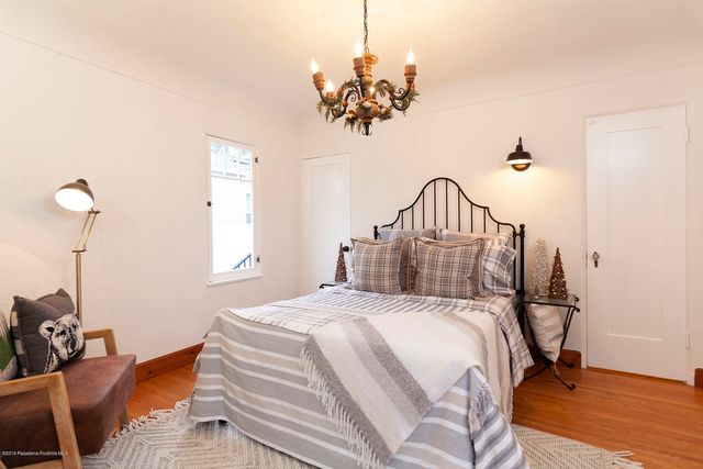 a view of a livingroom with furniture and a window