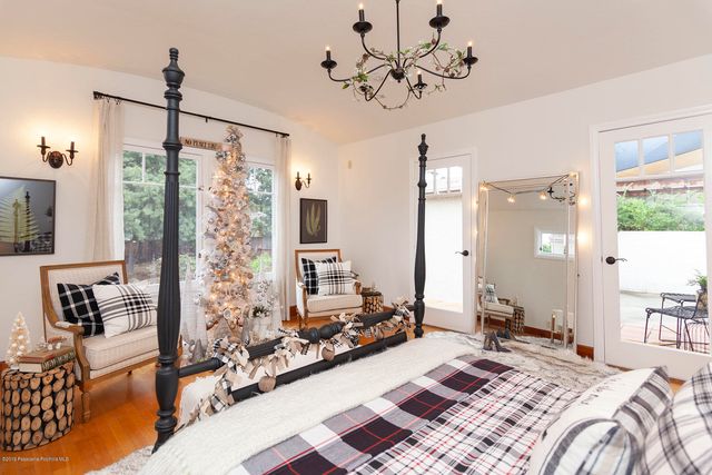 a bath room with a mirror and a bathtub