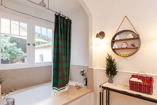 a view of a backyard with furniture and a fire pit