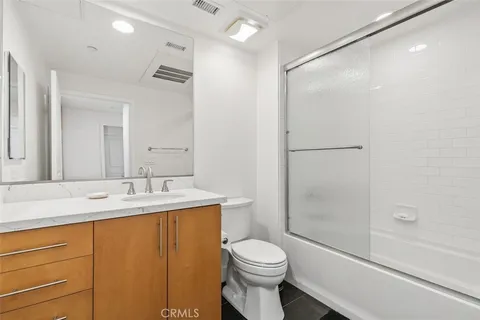 a bed room with a bed and a tv