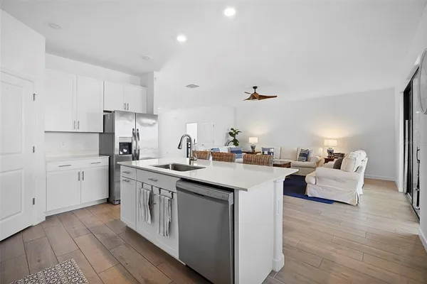a living room with furniture a couch and a window