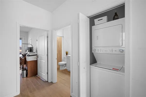 a bathroom with a sink a toilet and a large mirror