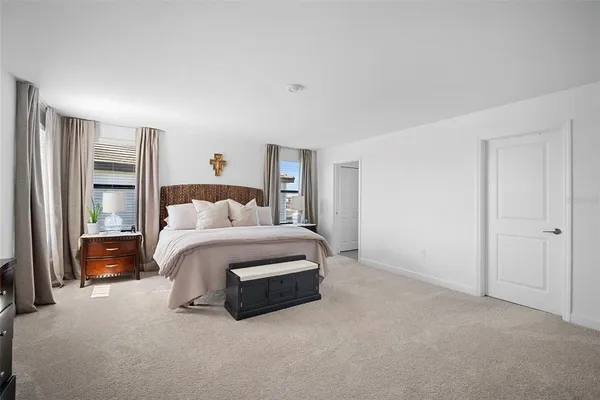 a bedroom with a bed and a closet