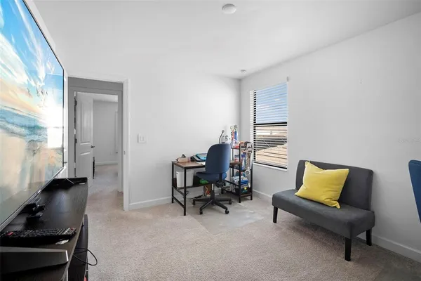 a front view of a house with large space and a yard