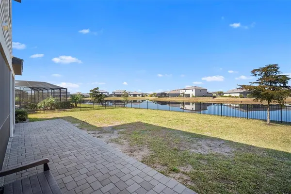 an aerial view of a residential building with swimming pool and ocean view
