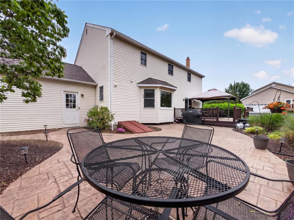 853 Lahr Road Nazareth, PA 18064 - Photo 25 of 29 An inviting stamped concrete patio and elevated wooden deck provide ample outdoor entertaining space.