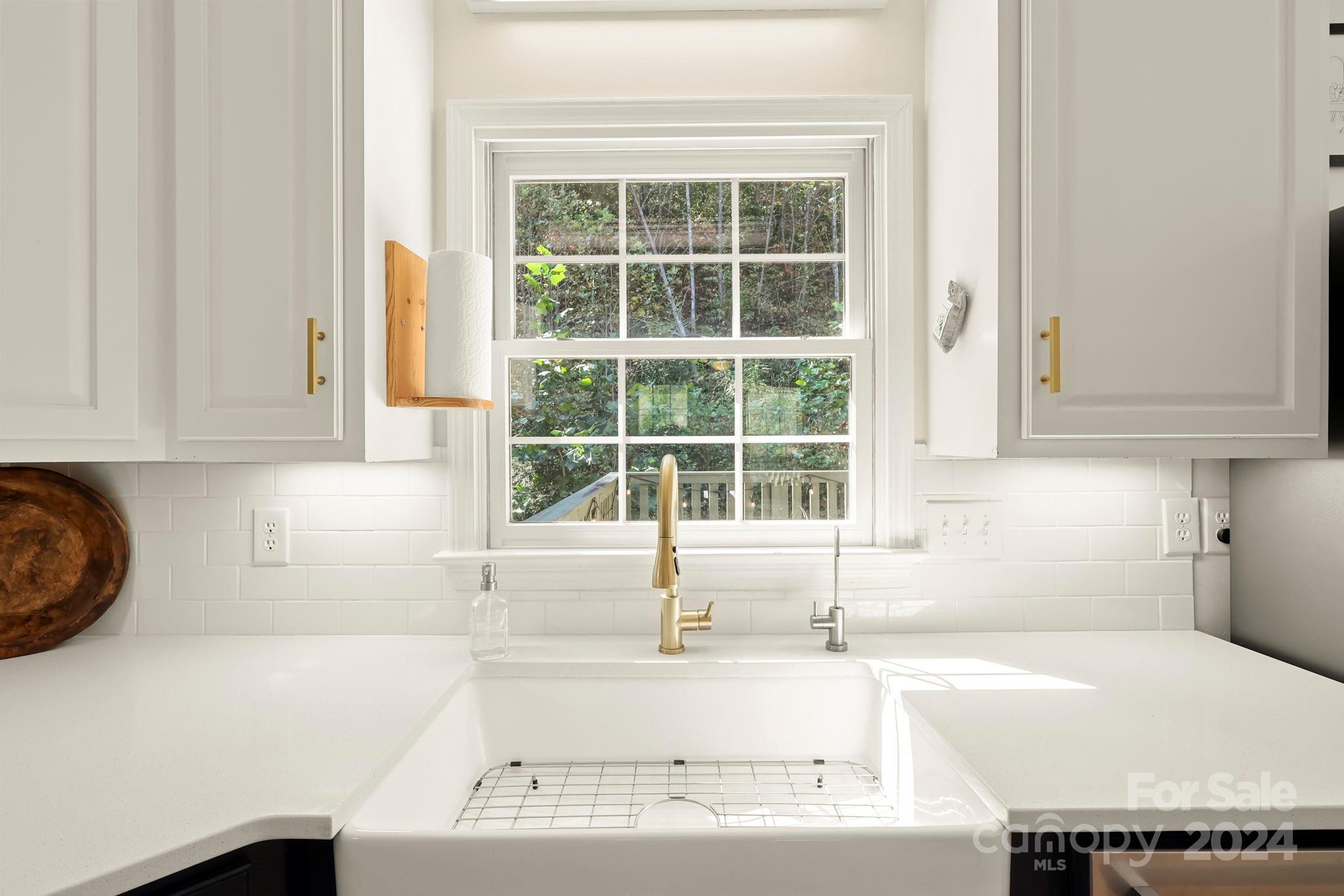 3409 Collettsville Road Lenoir, NC 28645 - Photo 11 of 48 a kitchen with granite countertop a sink and a window