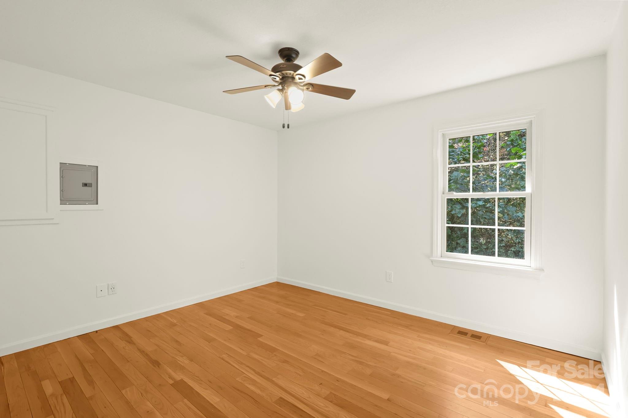 3409 Collettsville Road Lenoir, NC 28645 - Photo 17 of 48 a view of a big room with windows and chandelier fan