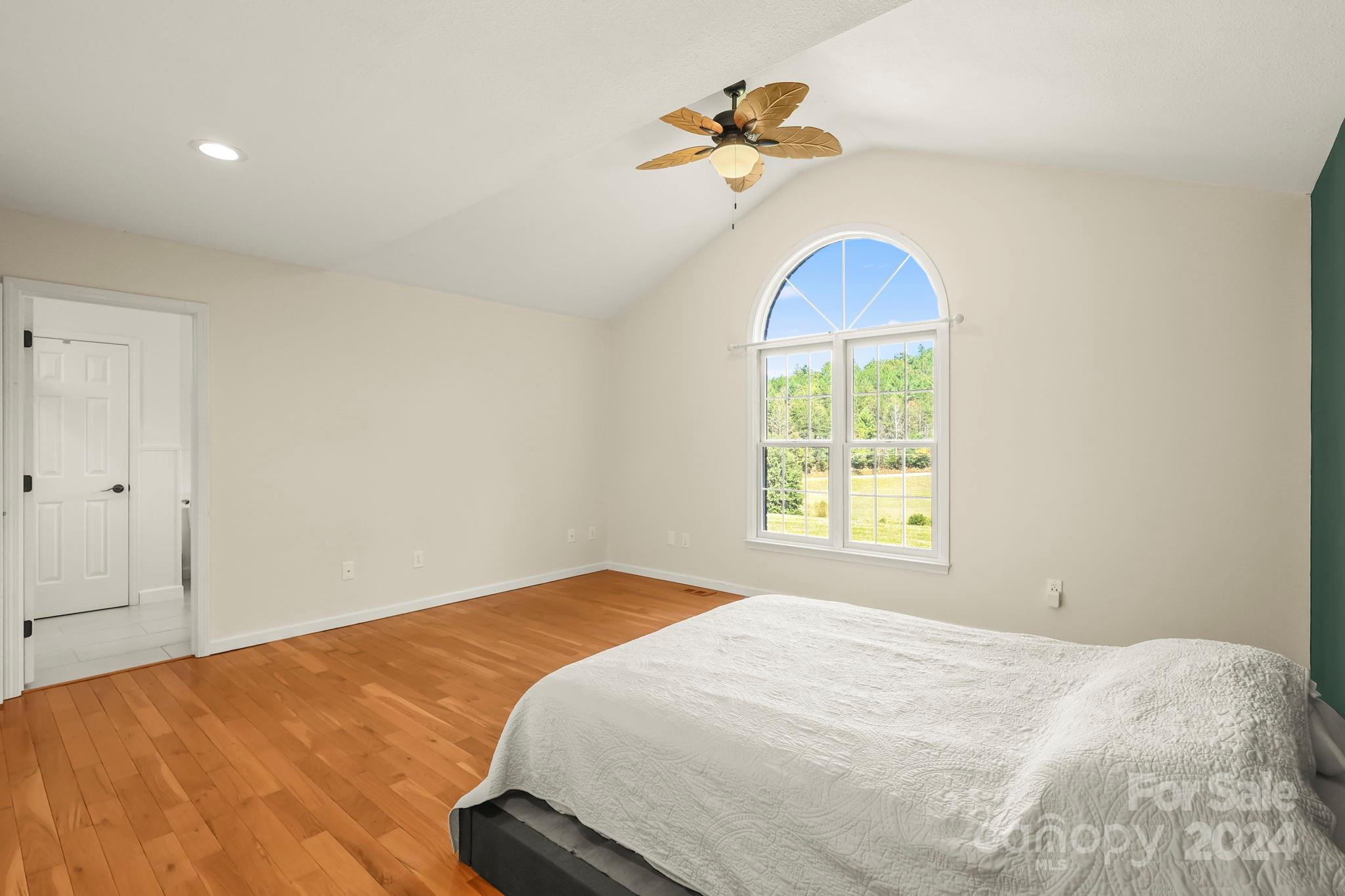 3409 Collettsville Road Lenoir, NC 28645 - Photo 24 of 48 a bedroom with a bed and a chandelier
