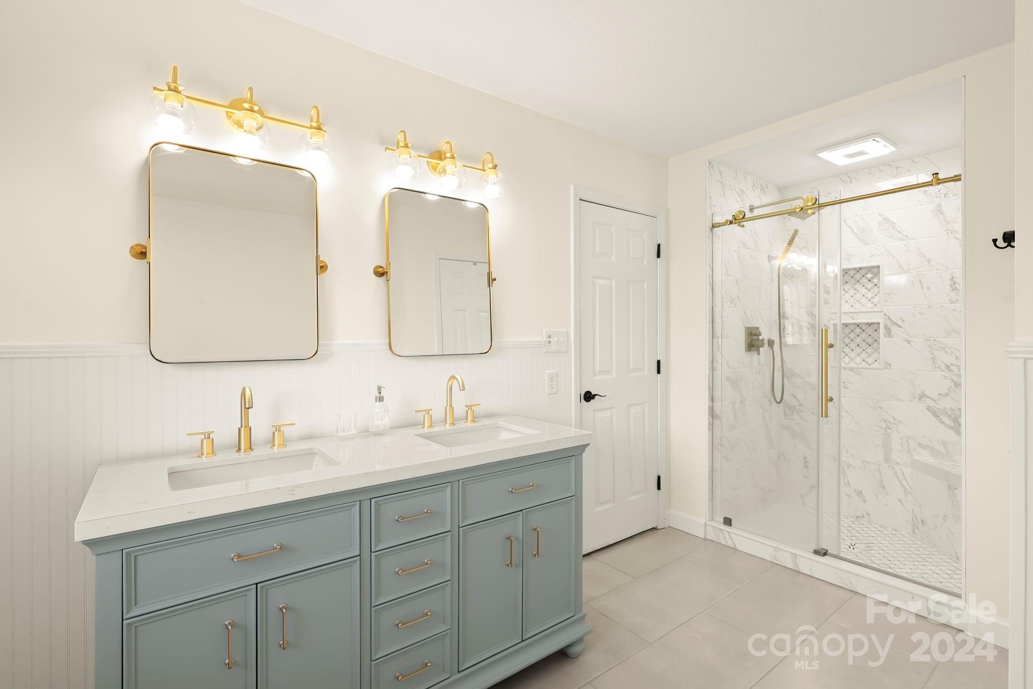 3409 Collettsville Road Lenoir, NC 28645 - Photo 26 of 48 a bathroom with a double vanity sink mirror and shower