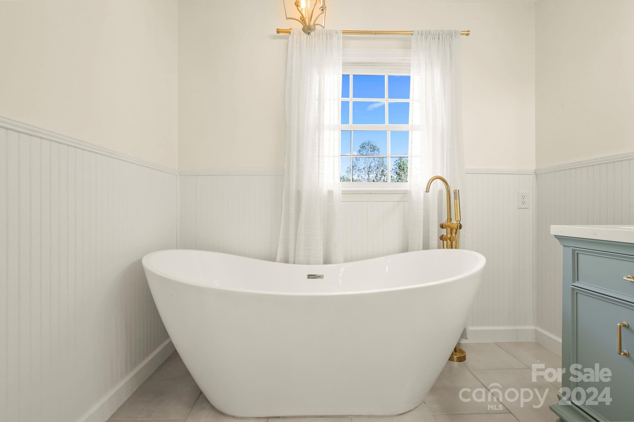 3409 Collettsville Road Lenoir, NC 28645 - Photo 28 of 48 a white bath tub sitting in a bathroom