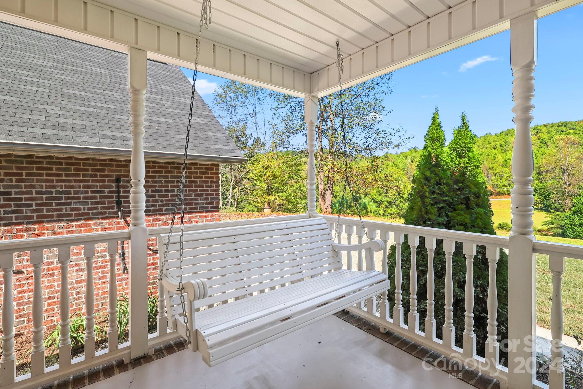 3409 Collettsville Road Lenoir, NC 28645 - Photo 4 of 48 a view of a porch with a bench